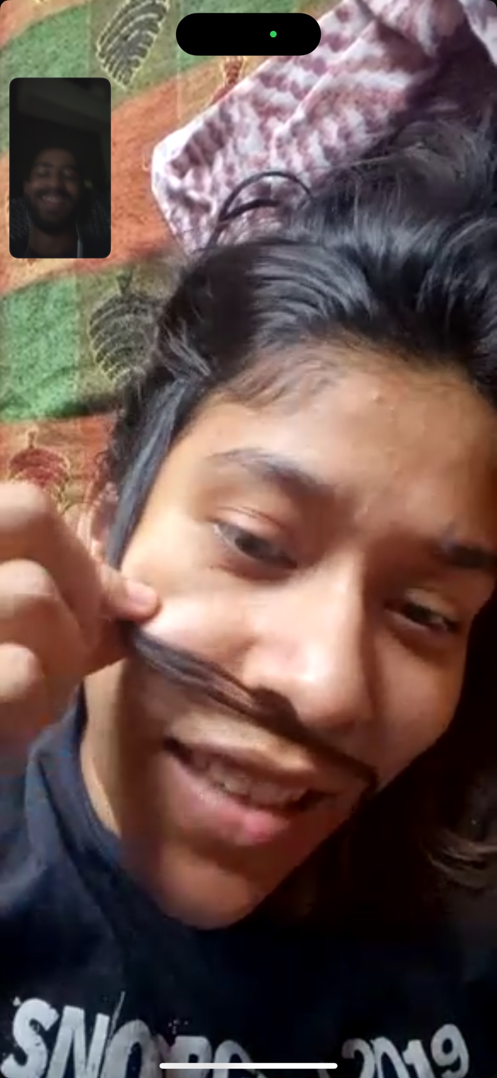 a strand of hair, held between lip and nose