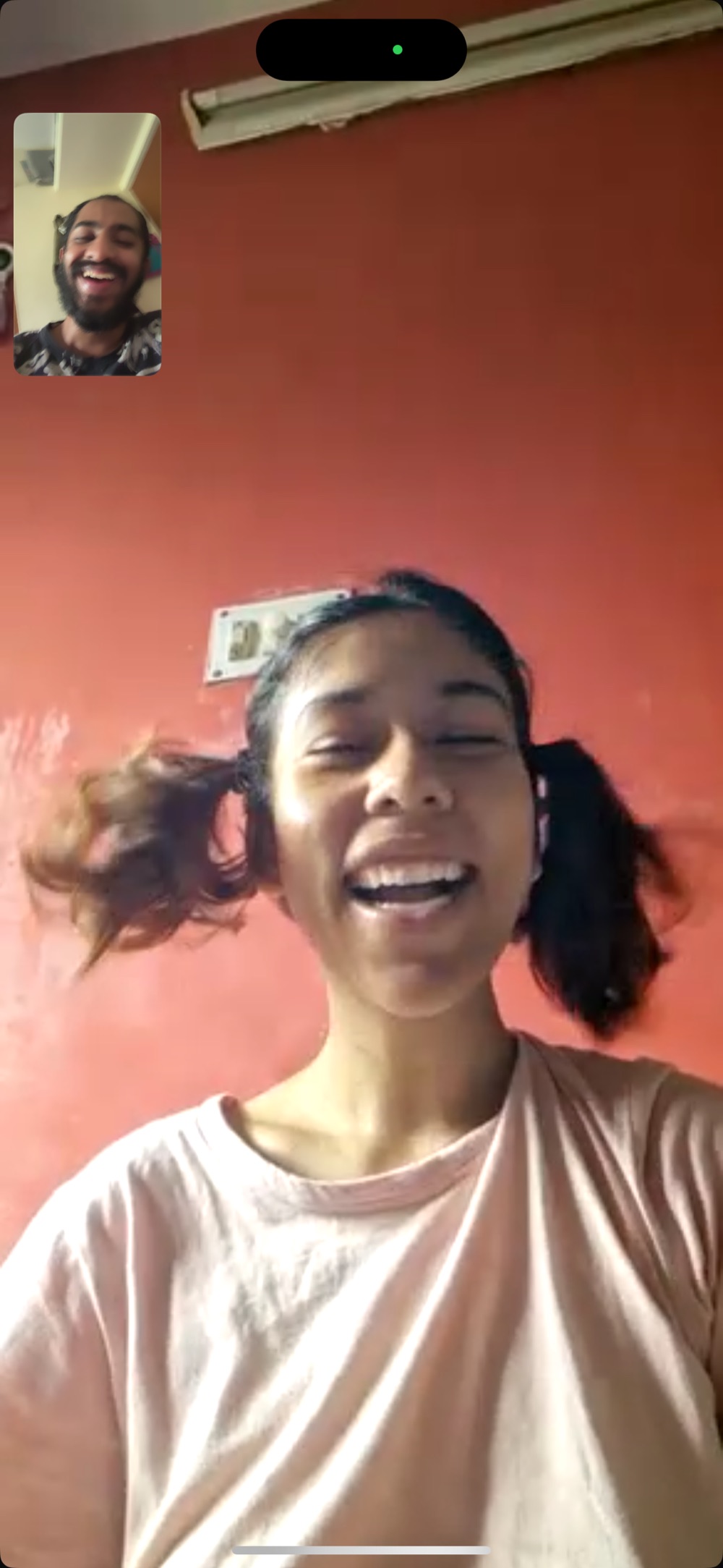 in front of the red wall, hair flying