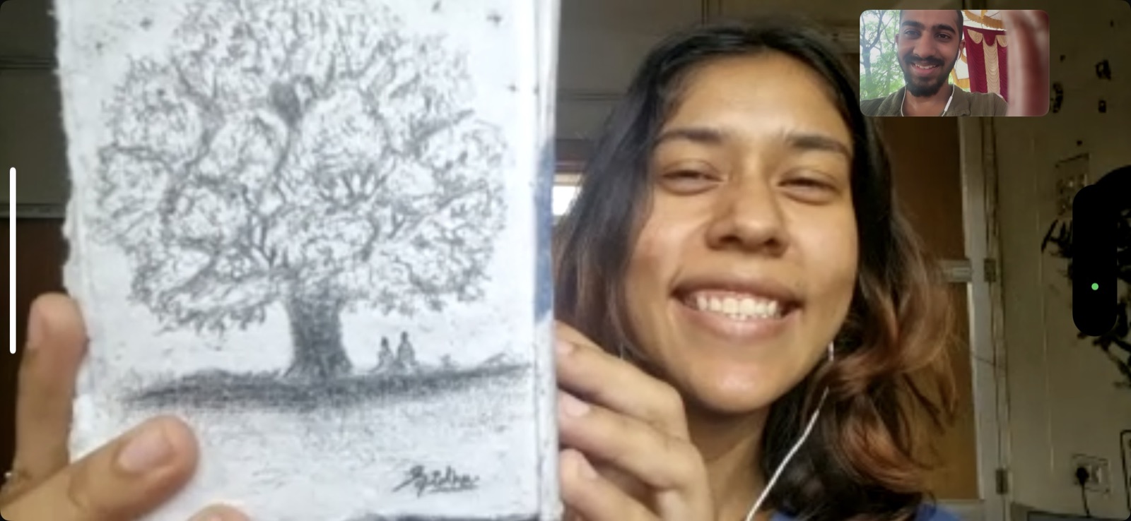holding up the drawing i gave her